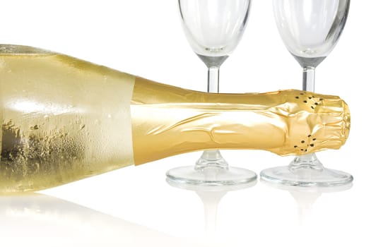 bottle and glasses of champagne over a white background