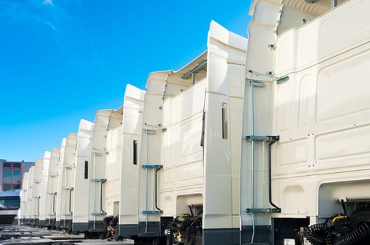 white trucks for rental on an industrial area