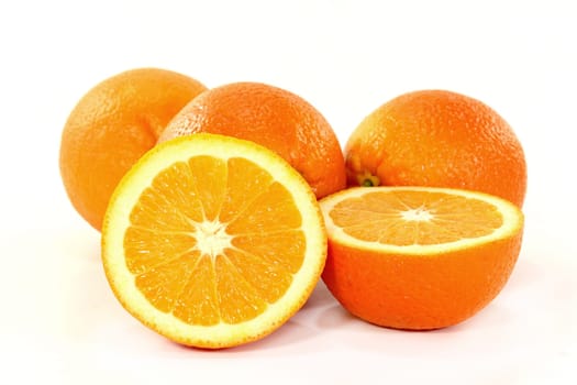 Fresh oranges against white background