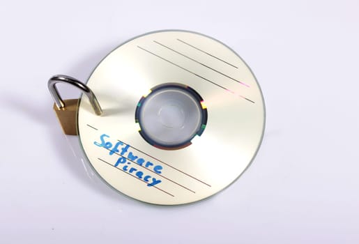 Piracy CD with padlock isolated on the white background