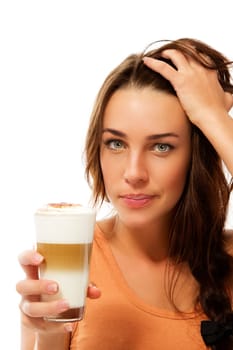 Young woman with latte macchiato coffee holding her hair against white background