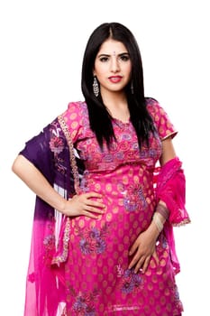 Beautiful Bengali Indian Hindu woman in colorful dress standing, isolated
