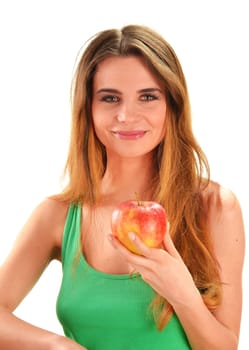 Young beautiful woman holding a red ripe apple in her hand