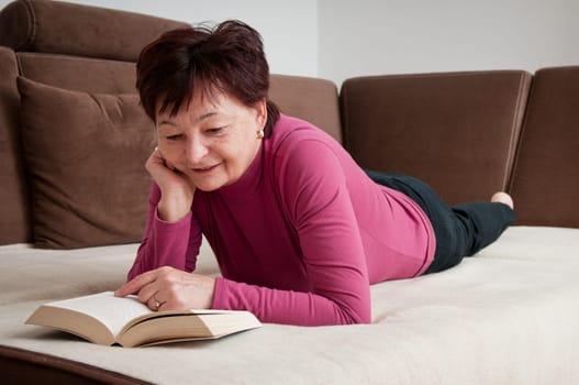 Senior woman reading book