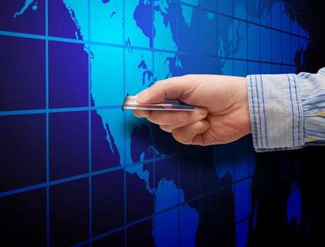 E-Commerce: Mans Hand With Credit Card and Map of World