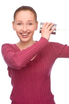 Studio shot of a young woman with a can phone