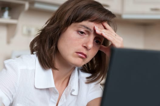 Depressed and tired business person at work