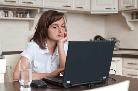 Bored and tired business person working at home