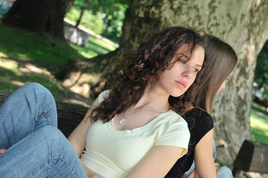 Friends outdoors series - two teenage girls are angry due to ther conflict