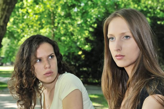 Friends outdoors series - one girl is offended and  second wants make a peace