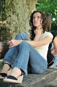 Friends outdoors series - two teenage girls are in conflick and do not speak with each another