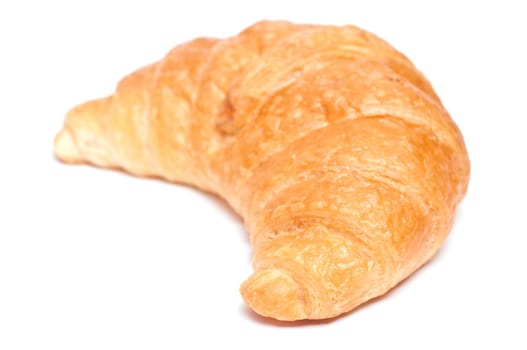 A croissant from the side and a white background