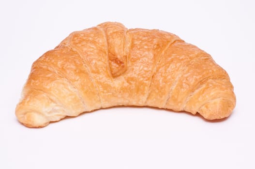 Close-up of a croissant against a white background