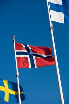 Scandinavian flags towards blue sky