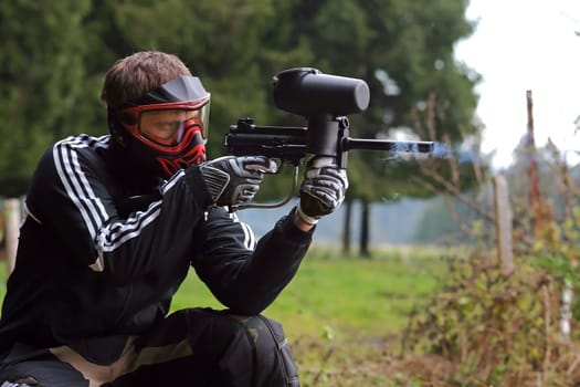 Paintball player in the game