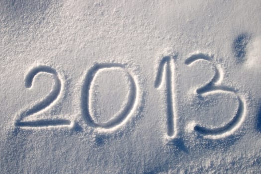 Message handwritten in fresh powdery snow for 2013