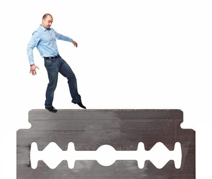man try to walk on razor blade