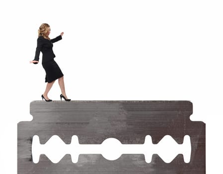 businesswoman walk on razor blade