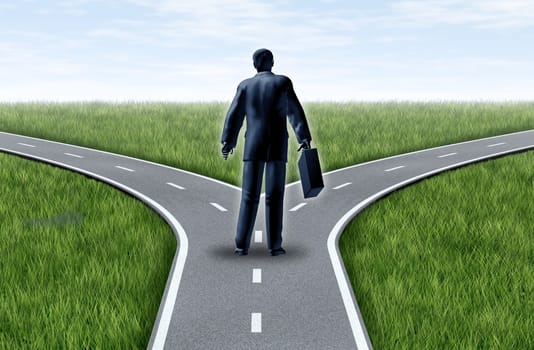 Career decision for a business man at a cross roads standing at a horizon with grass and blue sky showing a fork in the road representing the concept of a strategic dilemma choosing the right direction to go when facing two equal or similar job options.