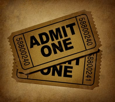 movie tickets with vintage grunge texture representing two stubs that admit one for show business price to enter and the cinematic theater entrance fee to go see the movies at the big screen.