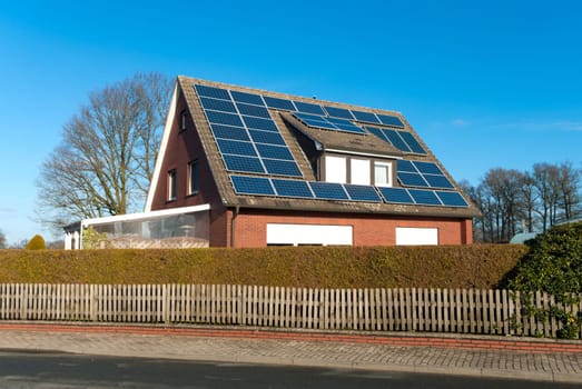 roof of a house covered with solar panels