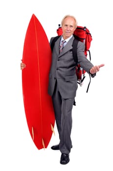 Mature businessman hitchhiking with backpack and surf board