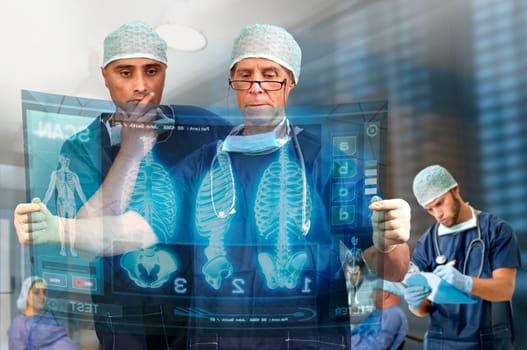 Doctors in a medical facility looking at digital screen