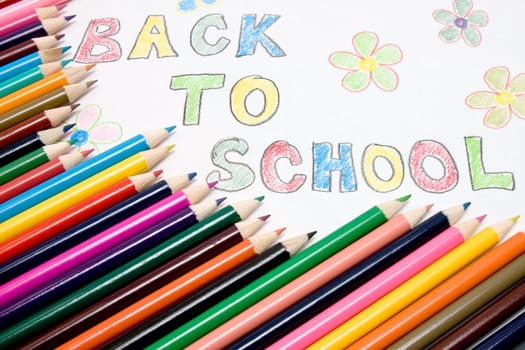 "Back to school"" text and color pencils"