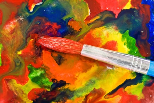 abstract painting. paintbrush on colorful painted paper