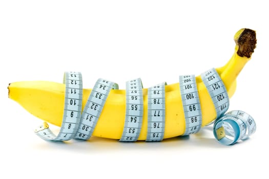 Diet and nutrition. Bananas wrapped with measuring tape