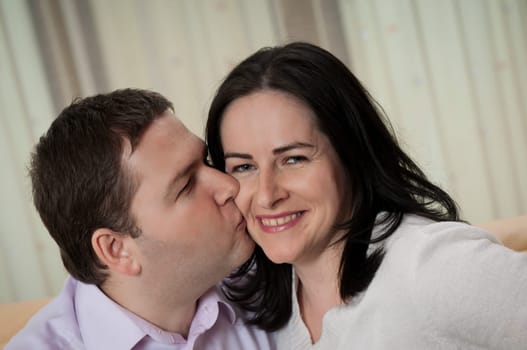 Love - couple indoors, man kissing her wife