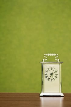 Old-fashioned clock shows the time ten past five
