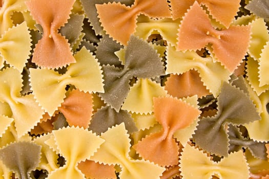 close up of uncooked multi-colored Italian macaroni