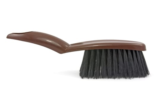 Brown brush for cleaning on white background