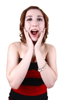 Closeup of a pretty teenager, holding her hands on her face and screaming loud for excitement, in a red and black striped dress, over white.