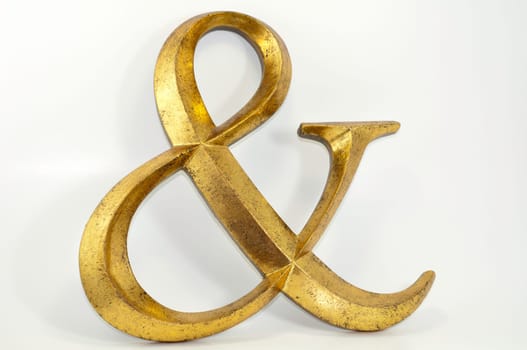 gold antiqued ampersand symbol decoration isolated on white background