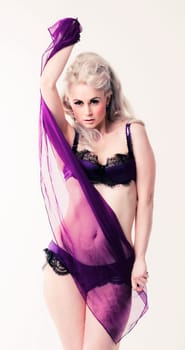 Young woman in purple lingerie