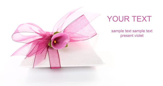 Small gift box decorated with ribbon and flower with copy space for your text