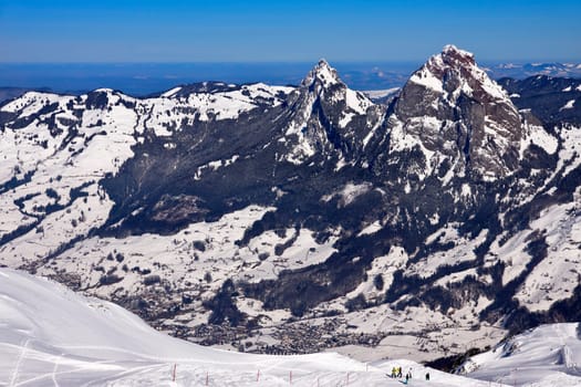View from the Fronalpstock to the city of Schwyz and the Mythen