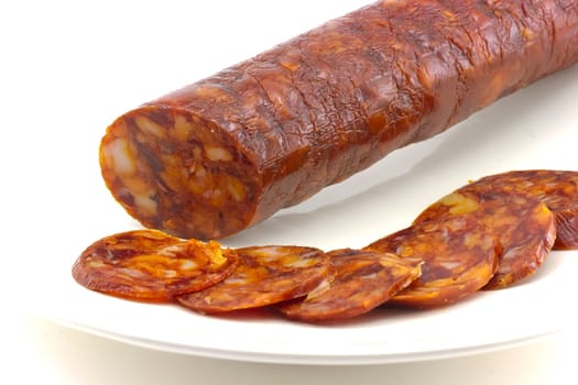 Iberian chorizo??, tasty sausage on plate, and sliced
