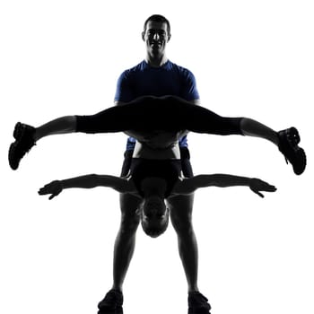 couple woman man exercising workout fitness aerobics posture in silhouette studio isolated on white background