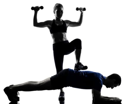 couple woman man exercising workout fitness aerobics posture in silhouette studio isolated on white background