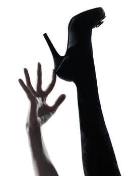 one woman legs silhouette on studio isolated white background