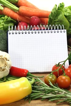 a checkered notepad and various ingredients