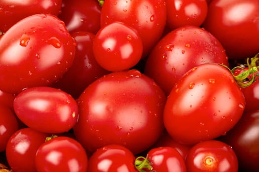 Fresh tomatoes covered with water pots