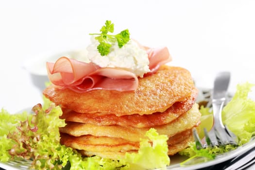 Delicious potato pancakes with curd cheese and herbs