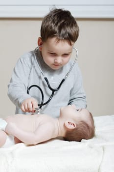Stethoscope listening to a baby&#039 s heartbeat