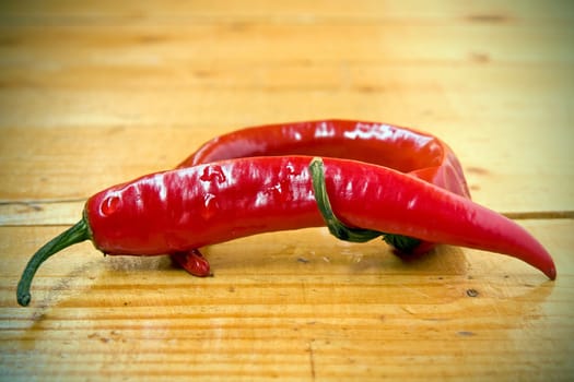 red Chili peppers on the wooden floor