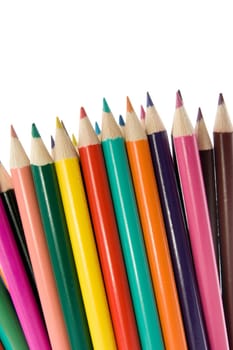 close up of color pencils over a white background