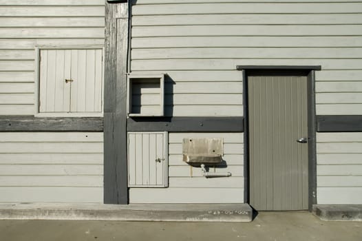 old grey wooden warehouse, with steel sink